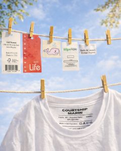 Custom clothing labels including woven labels, printed labels, hang tags, and tagless heat transfer labels for apparel branding.