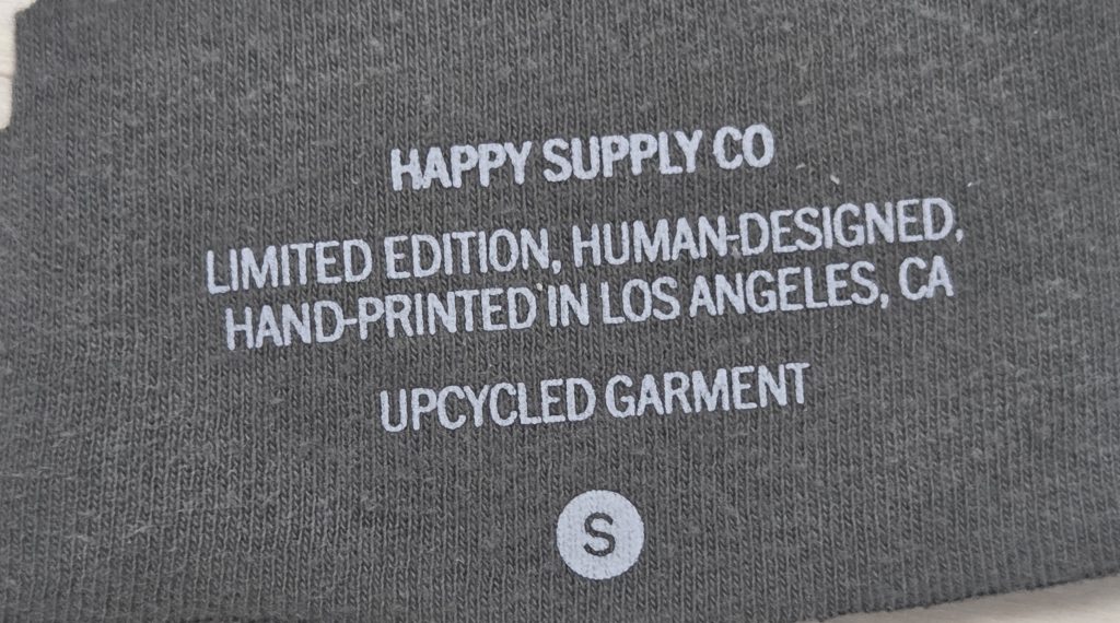 Tagless heat transfer clothing label applied directly to a garment