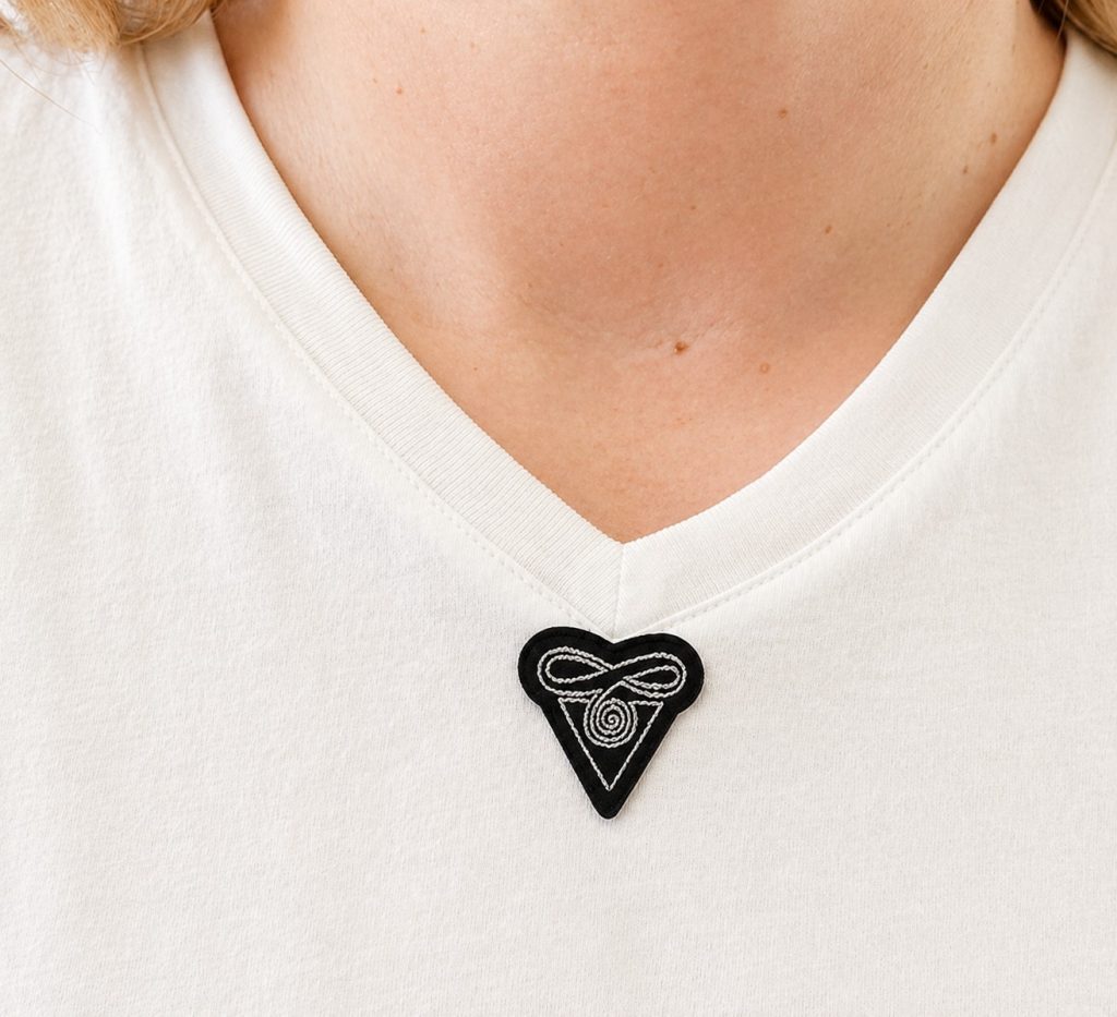 die cut heat transfer label applied to front of shirt for clothing branding