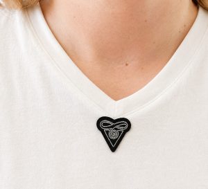 die cut heat transfer label applied to front of shirt for clothing branding