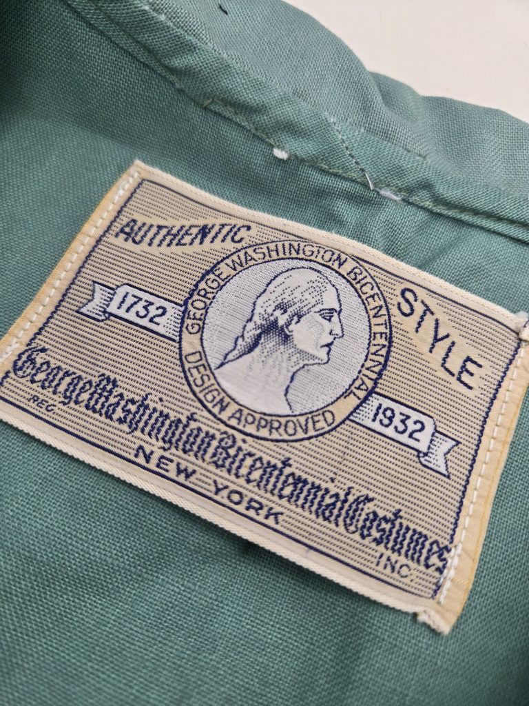 Vintage shuttle loom woven clothing label sewn into garment for premium apparel branding